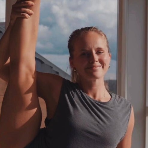 Woman in a yoga pose with a quote about movement and physical practice.